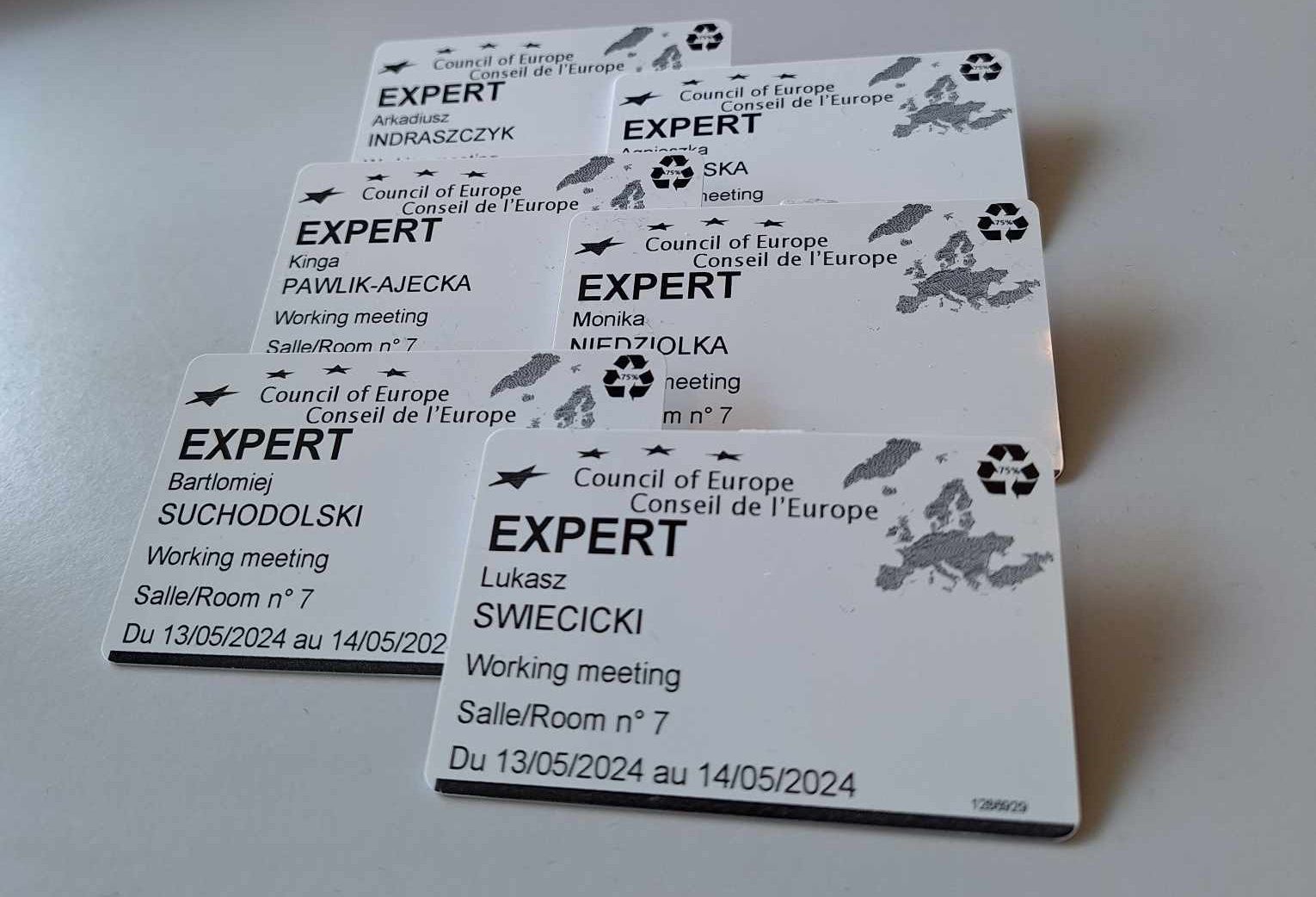 The photo shows the project team members' IDs